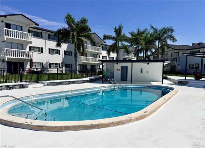 Community pool featuring a patio area