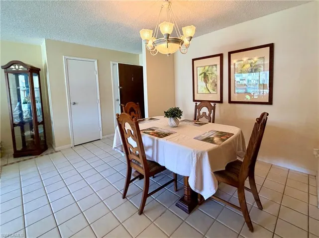 Open Dining space with light tile patterned floors