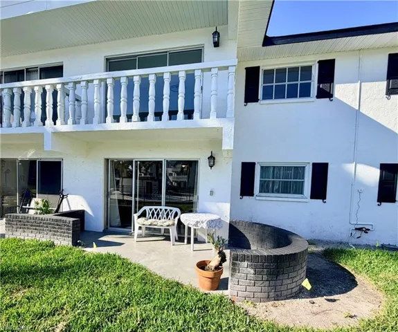 Rear view of property featuring a patio area
