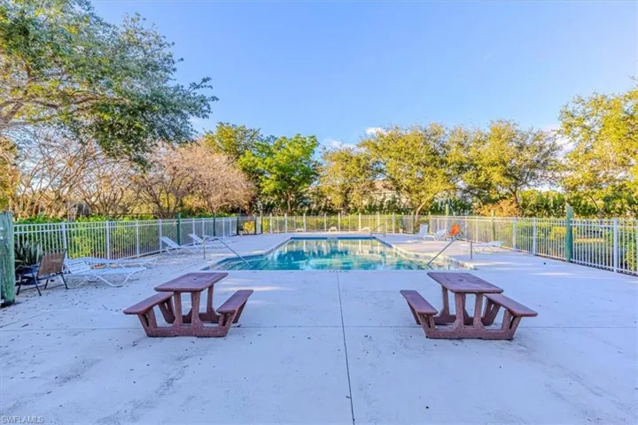 Community pool featuring a patio