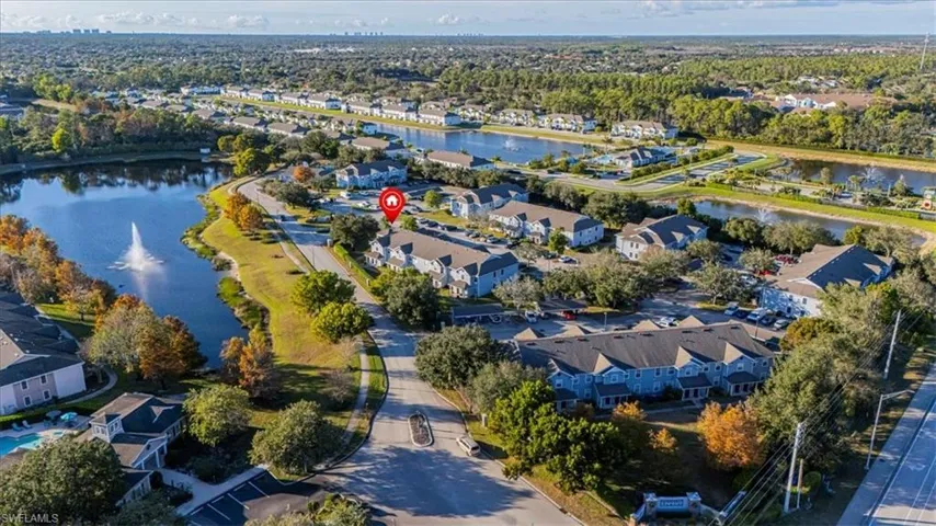 Aerial view of residential area featuring a large body of water