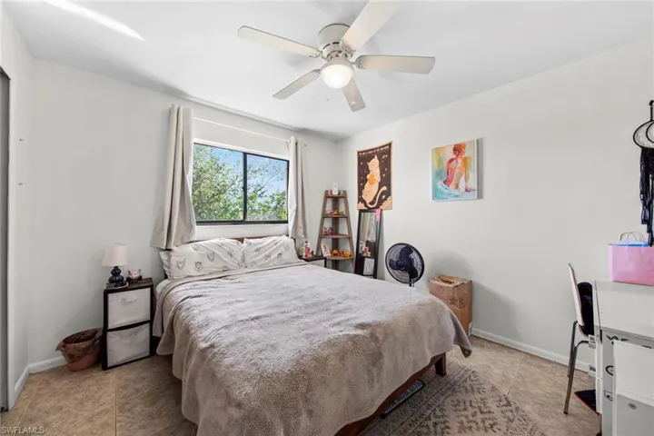 Bedroom featuring ceiling fan and light tile patterned floors