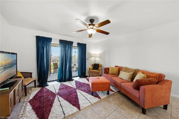 Tiled living room with ceiling fan