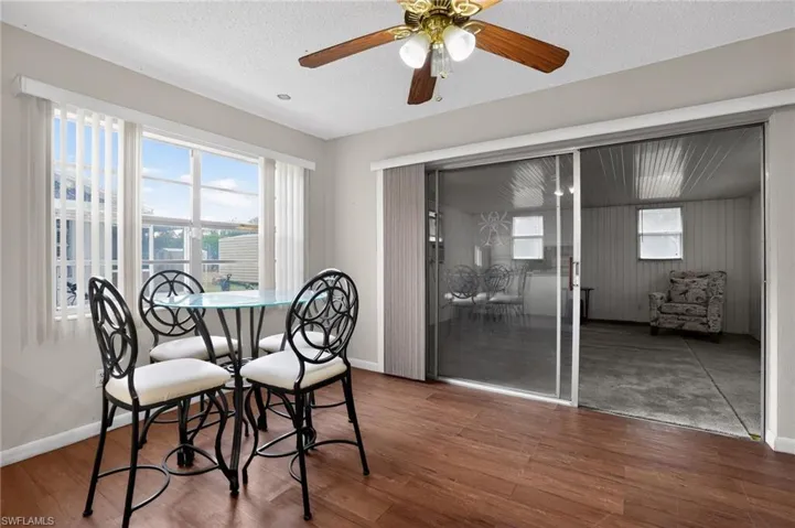 Dining space with  ceiling fan & vinyl floors