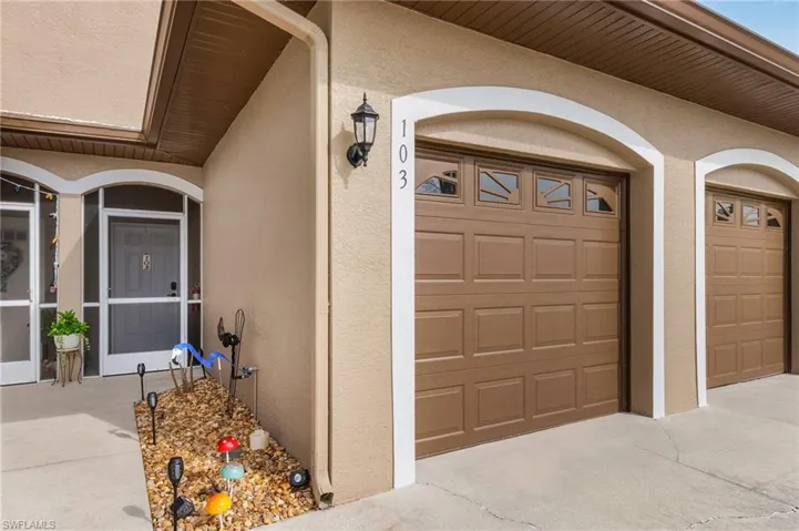 Property entrance featuring a garage