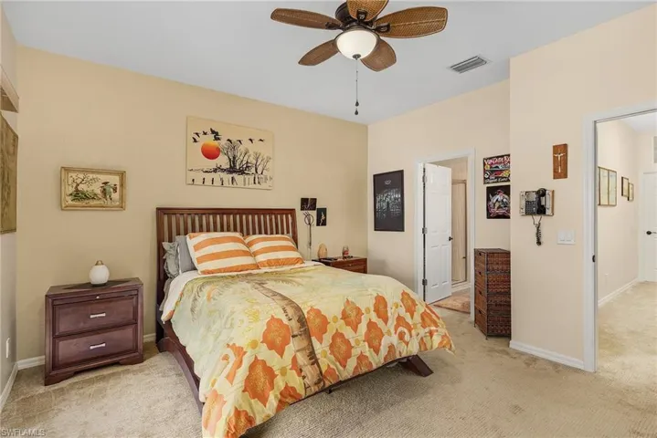 Bedroom featuring ceiling fan and light colored carpet