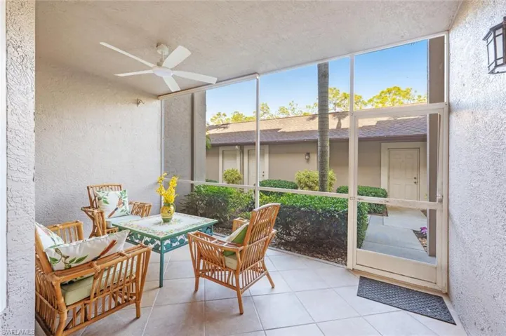 Sunroom featuring ceiling fan