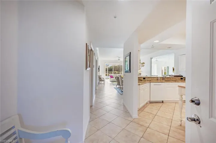 Hall featuring light tile patterned flooring and recessed lighting