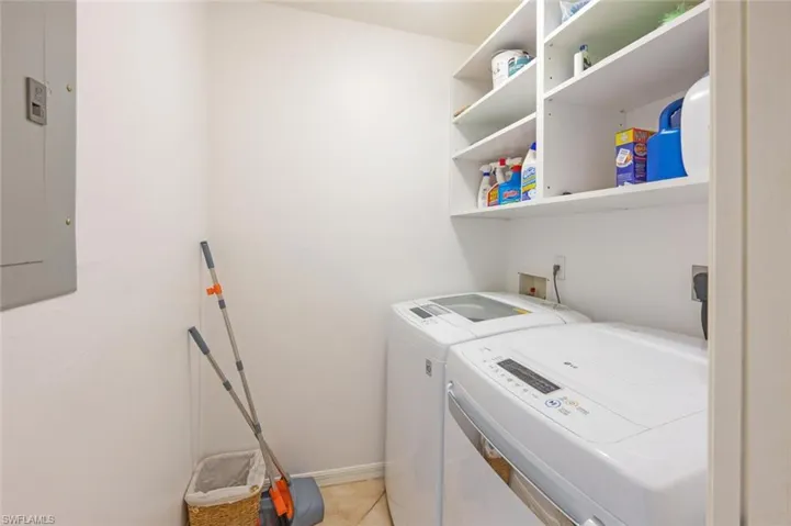 Washroom with electric panel and separate washer and dryer