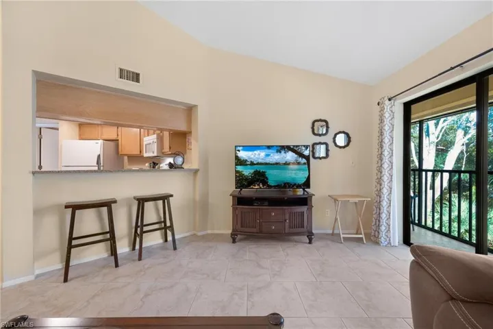 Living area featuring light tile patterned floors