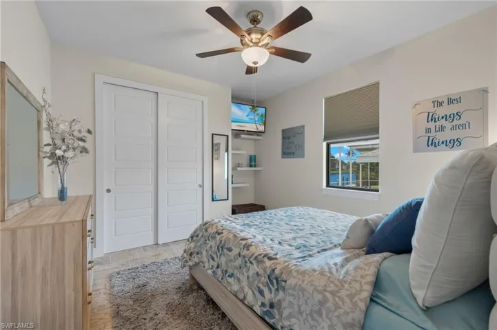 Bedroom featuring a closet and ceiling fan