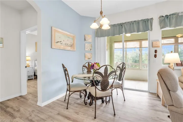 Dining room featuring a chandelier and light wood-type flooring