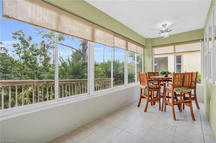 Sunroom featuring ceiling fan