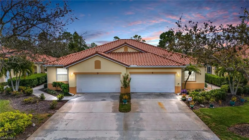 Mediterranean / spanish-style home with a garage
