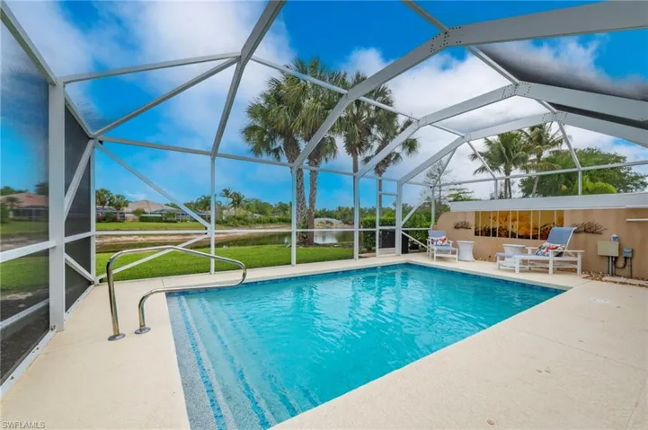 15366 Upwind Dr Bonita Springs FL 34135 - Resurfaced and updated pool with tile designs on steps and around pool
