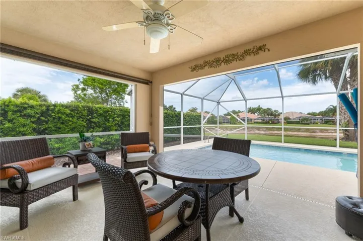 15366 Upwind Dr Bonita Springs FL 34135 - Storm protected and private lanai with long lake view.