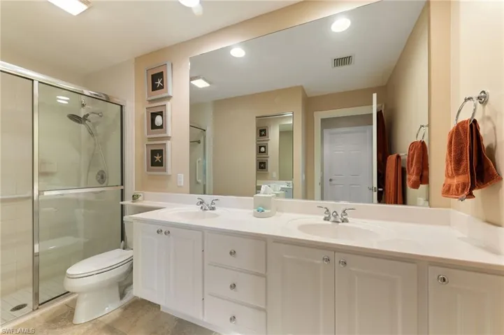 15366 Upwind Dr Bonita Springs FL 34135 -Owner's bath features linen closet, dual sinks and shower.
