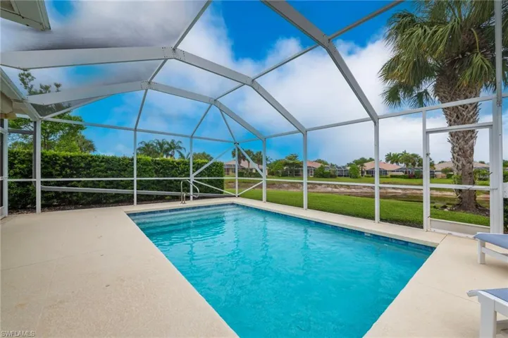 15366 Upwind Dr Bonita Springs FL 34135 - The hedge wall makes your pool area very private.