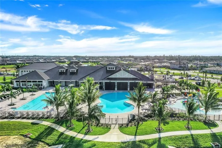 Pool featuring a yard, a residential view, and a patio