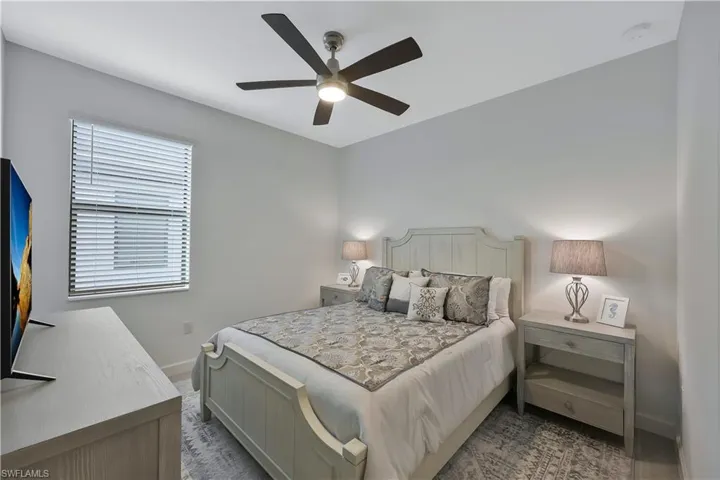 Bedroom with baseboards and a ceiling fan