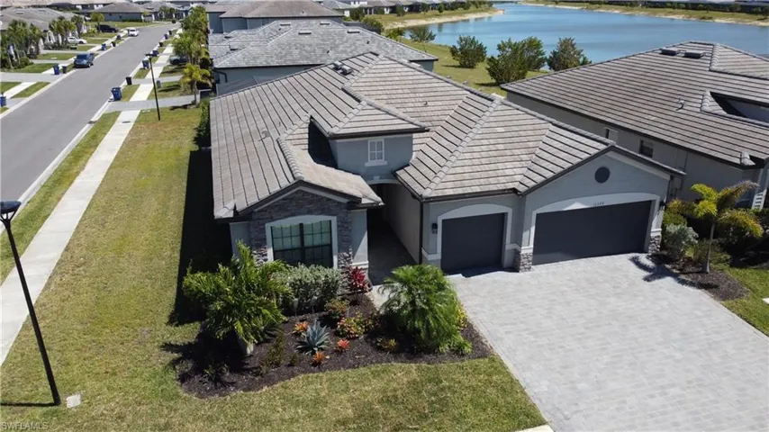 Aerial view featuring a residential view and a water view