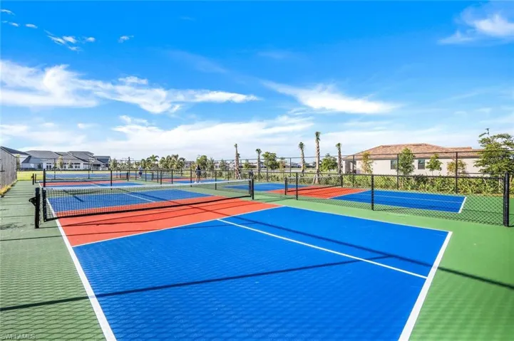 View of sport court with a residential view, community basketball court, and fence