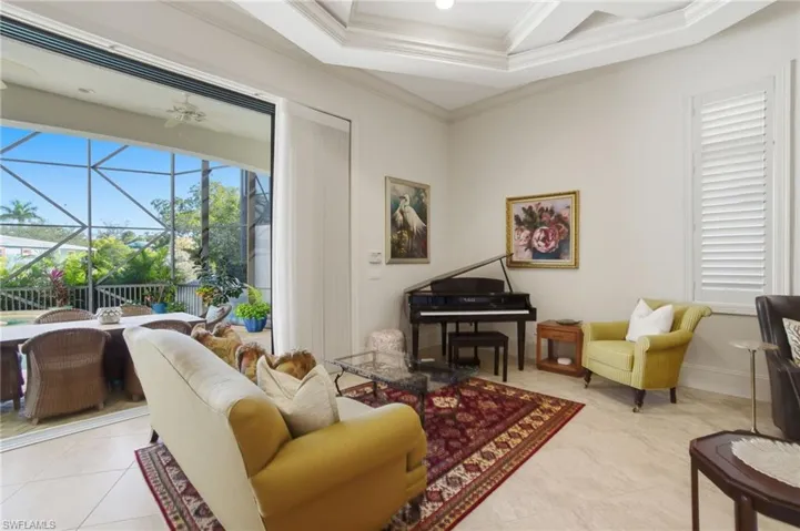 Seamless indoor/outdoor living via fully pocketing impact sliders with a saltwater pool, spa, outdoor kitchen with fireplace & pool bath, all overlooking the canal & Imperial River.