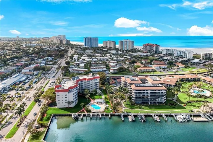 View of urban area featuring a large body of water and apartment complex