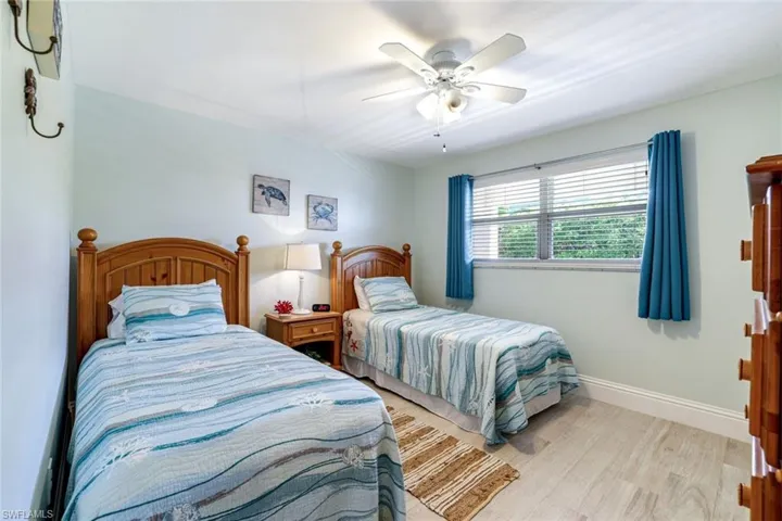 Bedroom featuring light wood-style flooring and ceiling fan