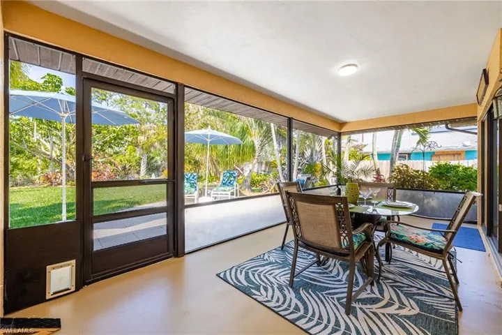 Large screened Lanai. Well lit, cement flooring, Great outdoor living/dining space.