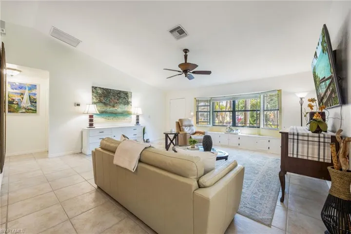 Expansive Living Room. Built in storage below the Bay Window.