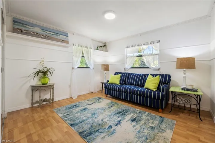 Bedroom 3 currently set up as a sitting / reading room. Laminate Flooring with loads of natural lighting.