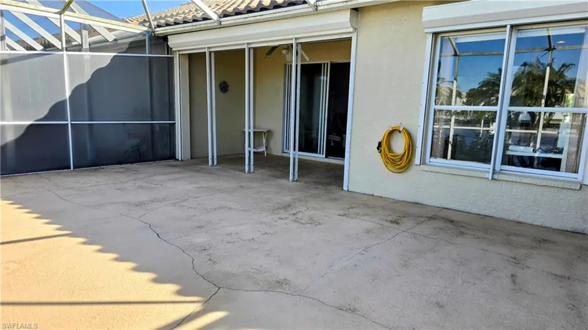 View of patio with a lanai