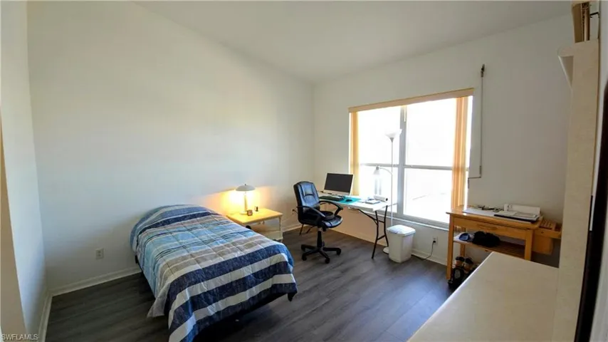Bedroom featuring dark hardwood / wood-style flooring