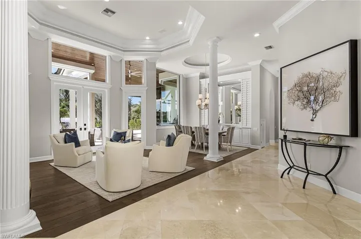 View of living and dining with marble tile and Vietnamese wood floors with spectacular views.