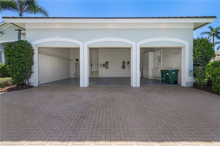 3 Car Garage with decorative pavers driveway. Also where the central vacuum system, hot water heater is located.