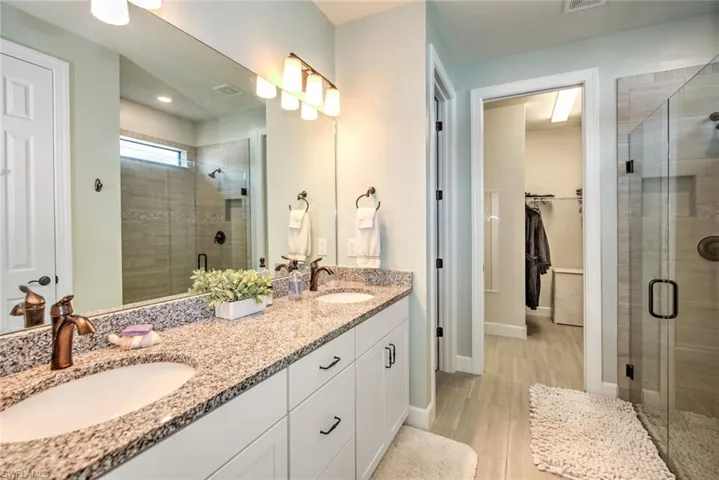 Bathroom with vanity and walk in shower