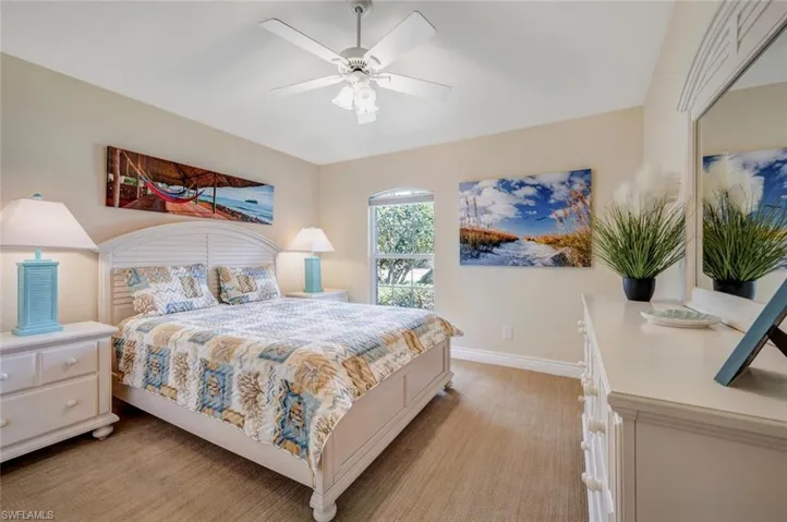 Carpeted bedroom with ceiling fan
