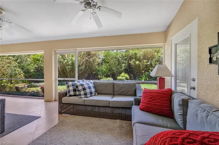 Sunroom featuring ceiling fan