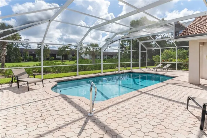 Outdoor pool featuring a patio, a lanai, and a sunroom