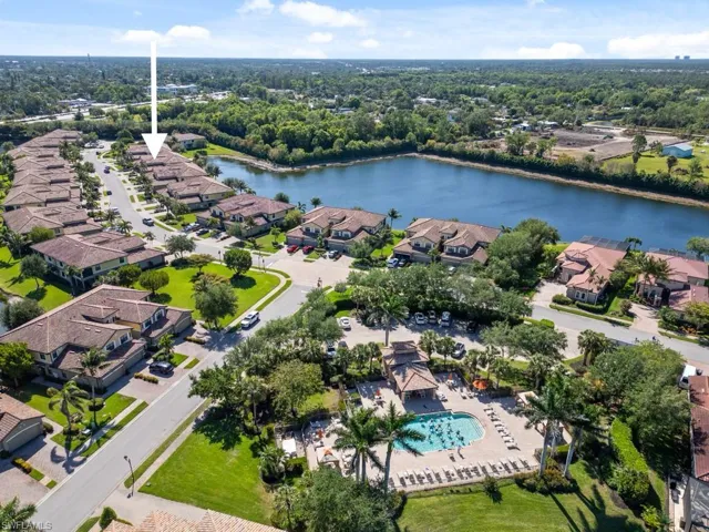 Aerial view featuring a water view and a residential view