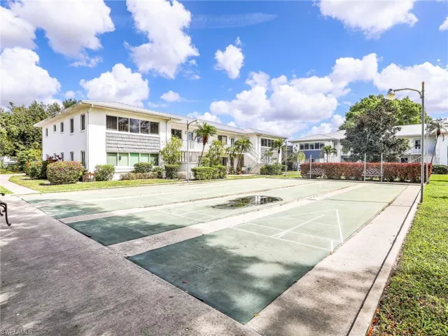 View of home's community with shuffleboard