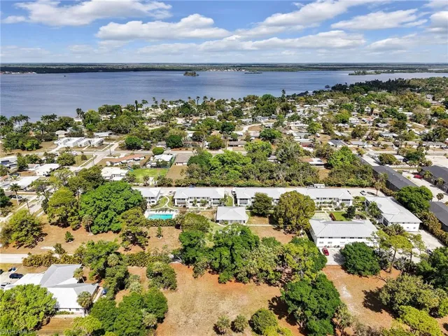 Aerial view of residential area featuring a large body of water