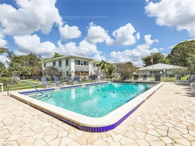 Community pool with a patio area