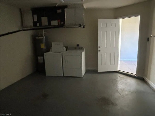 Washroom with water heater and separate washer and dryer