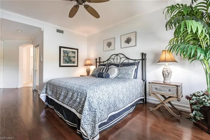 Bedroom with Elm hardwood floor, king bed and water views