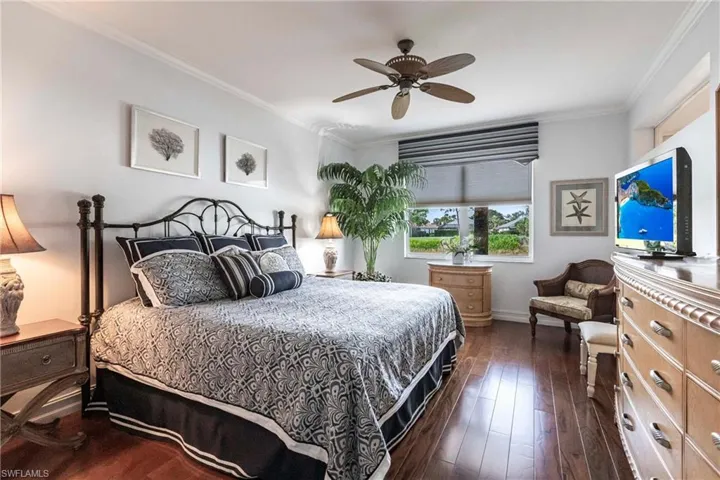 Bedroom with Elm hardwood floor, king bed and water views