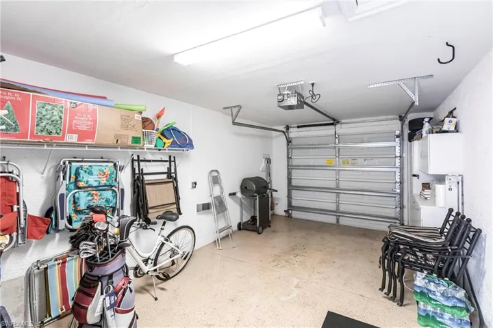 Garage featuring a garage door opener