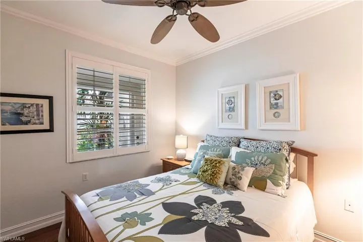 Bedroom featuring crown molding and ceiling fan