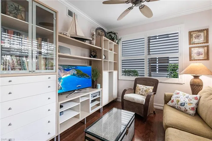 Den with Elm hardwood floor and built in cabinetry